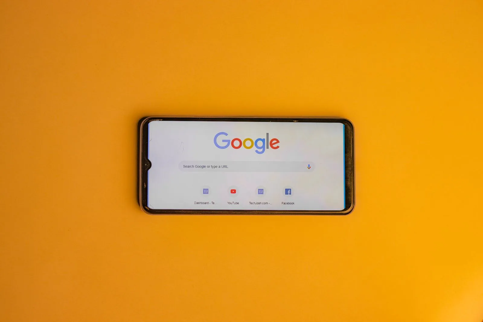 Smartphone showing a Google search results page with an AI-generated answer at the top - the new shape of the local SERP in 2026