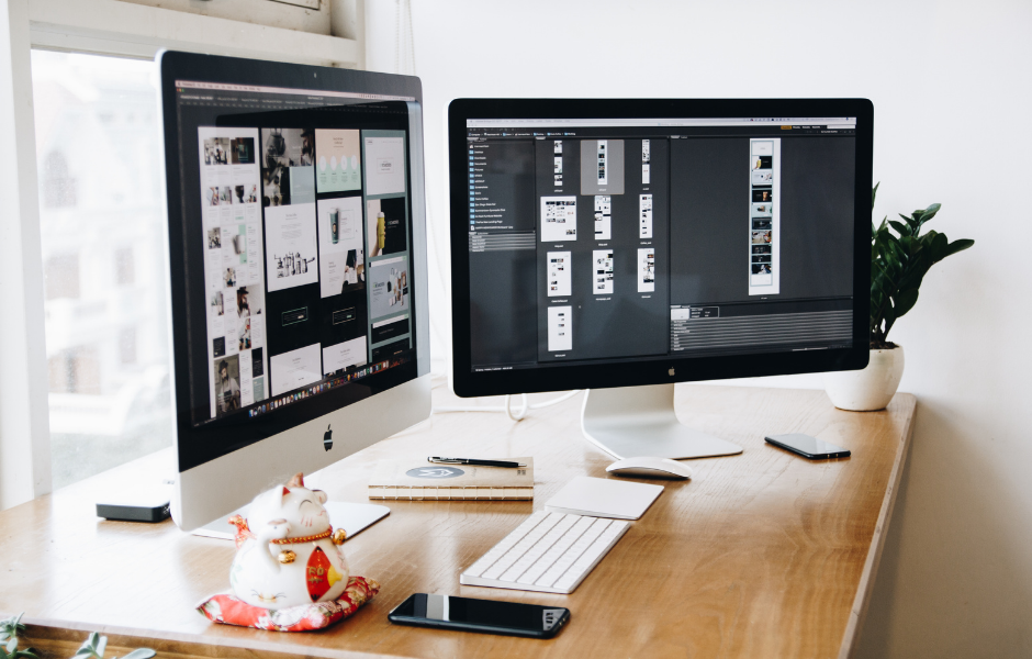 Designer working on a web design project with color palettes